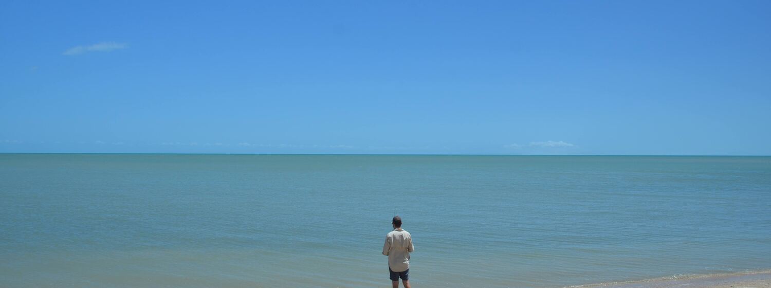 Helicopter on a remote sandbar at a Cape York river mouth