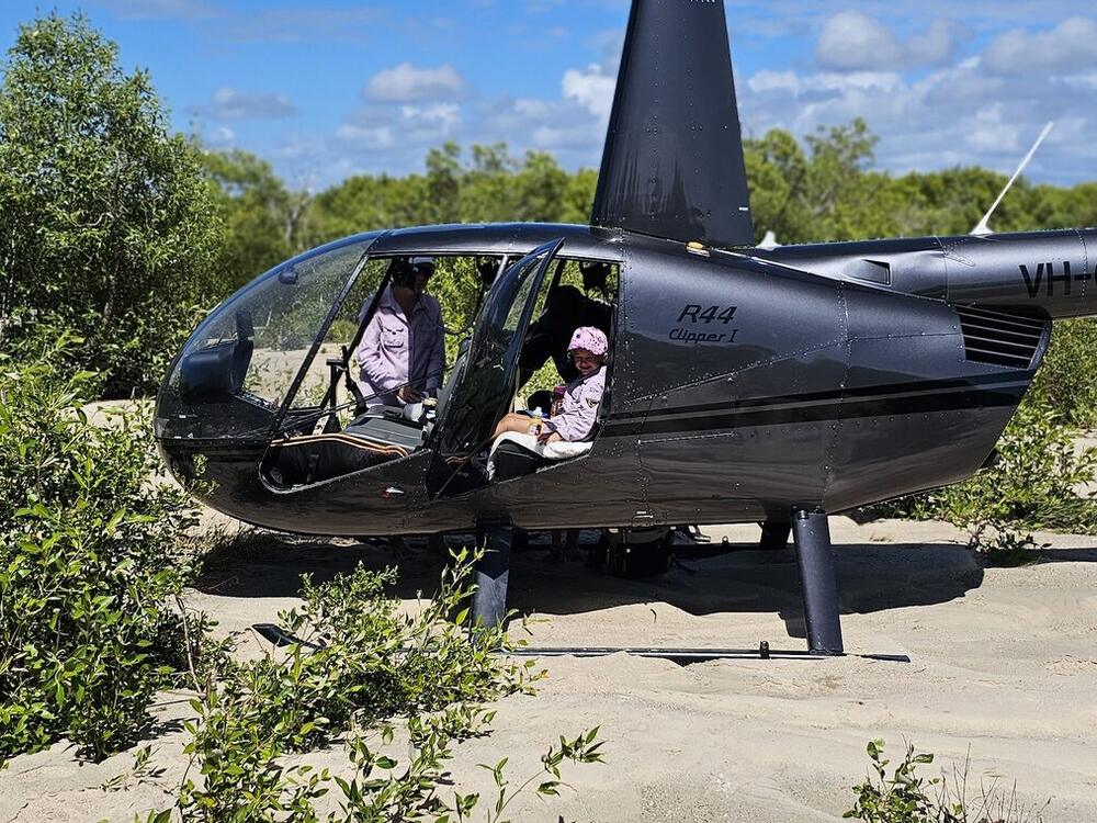 Helicopter landed in scrub on an aerial weed-survey job